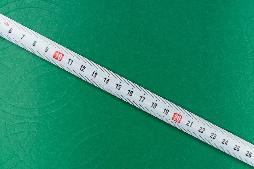 Diagram showing proper monitor height and distance with measurements indicating eye level alignment and arm's length positioning